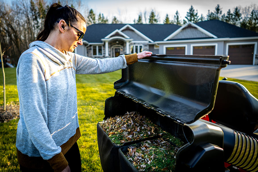 Ariens lawn mower bagger Fall scene including a bagger filled with leaves on an Ariens zero-turn lawn mower